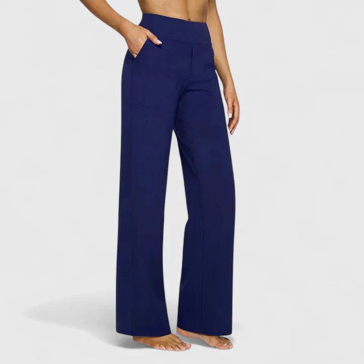 Pantalones elegantes Ame de Warszawska Elegancja, estilo sofisticado y corte ajustado, en color oscuro.