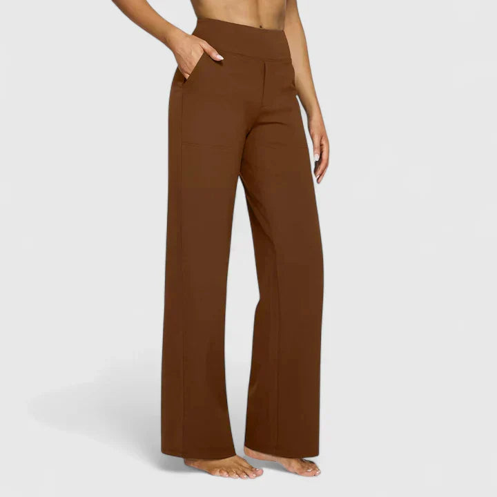 Pantalones elegantes Ame de Warszawska Elegancja, pantalones de vestir en color neutro con corte moderno y detalles sofisticados.