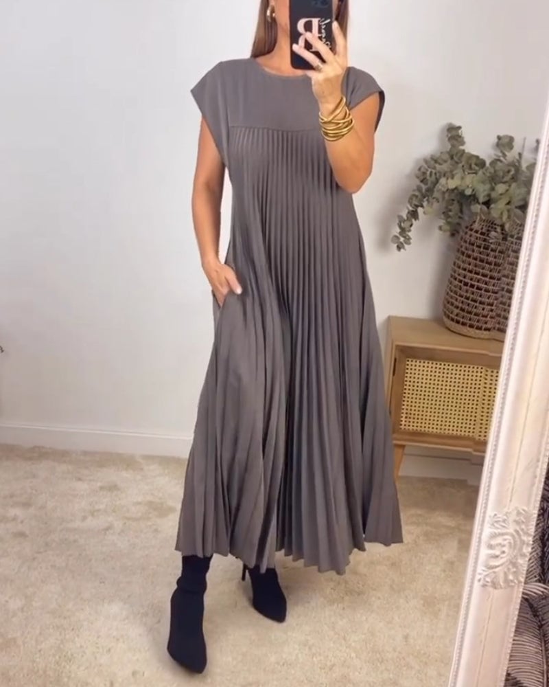 Vestido Aleksandra de Warszawska Elegancja, diseño clásico y cómodo, con tela suave y corte elegante en color neutro.