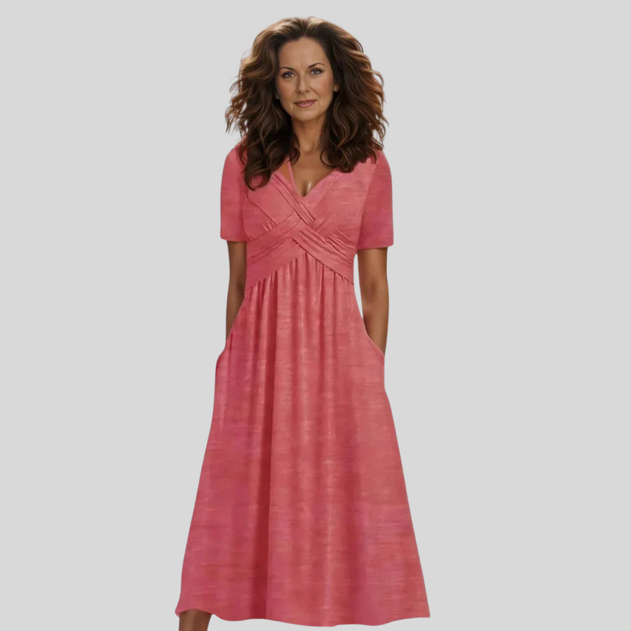 Vestido elegante Adéla de Warszawska Elegancja, en color neutro, con corte ajustado y detalles sofisticados para ocasiones especiales.