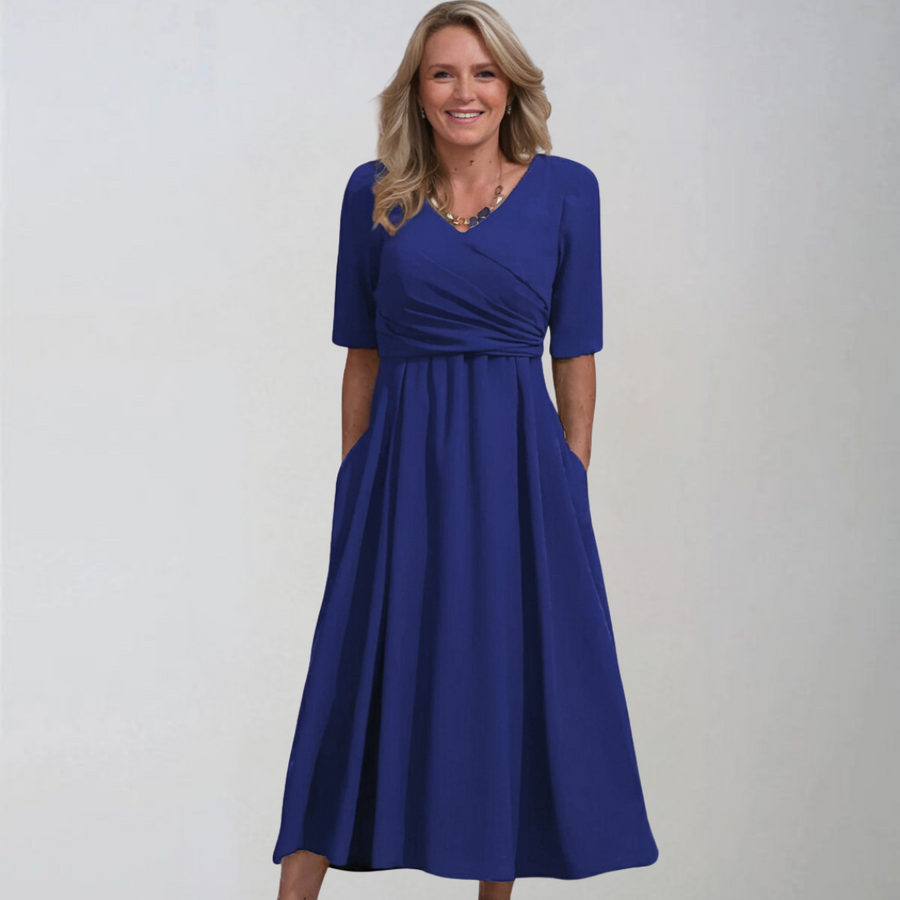 Vestido midi estilo Petra de Warszawska Elegancja con bolsillos, diseño elegante y moderno en color neutro.