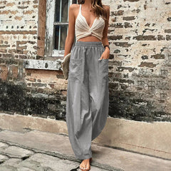 Pantalones sueltos Vanna de Warszawska Elegancja, estilo casual, en color neutro, con cinturilla y bolsillos visibles.