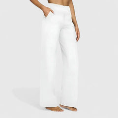 Pantalones cómodos Jasmynne de Warszawska Elegancja, en color neutro, con corte recto y cintura elástica, vistas desde frente.