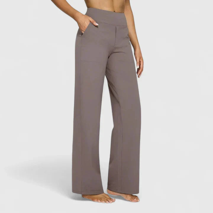Pantalones elegantes Ame de Warszawska Elegancja, en color oscuro, con diseño moderno y ajuste ajustado para mujer.