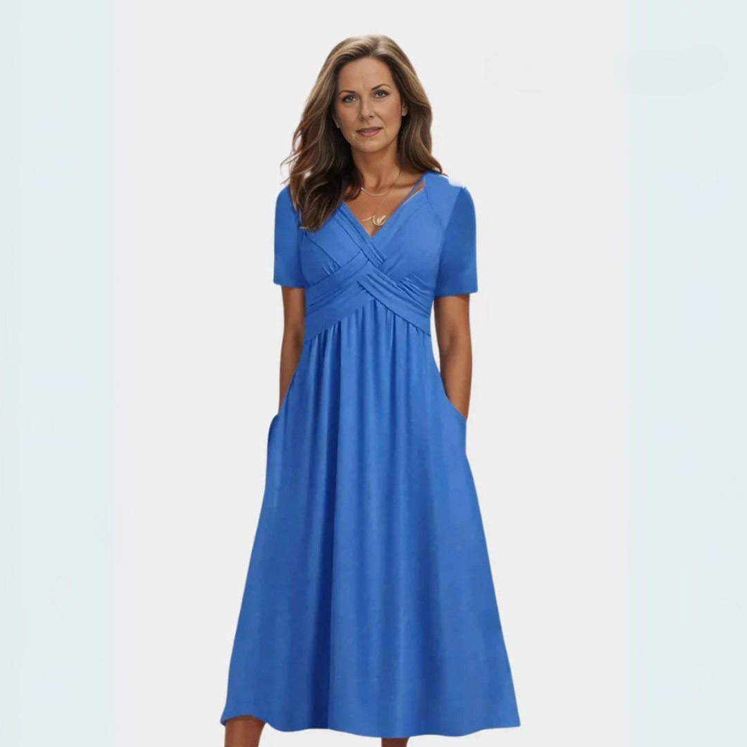 Vestido elegante Adéla de Warszawska Elegancja, ajustado y sofisticado, mostrado en color azul en la imagen.
