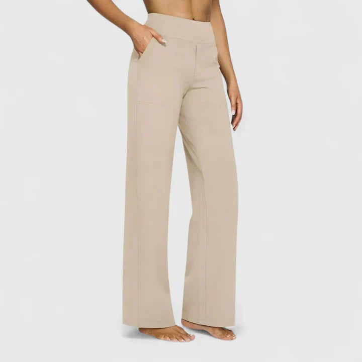 Pantalones elegantes Ame de Warszawska Elegancja, vista en color oscuro y corte moderno, para un estilo sofisticado.