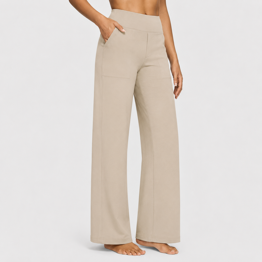 Pantalones cómodos Jasmynne de Warszawska Elegancja en color neutro, ideales para un estilo casual y elegante.