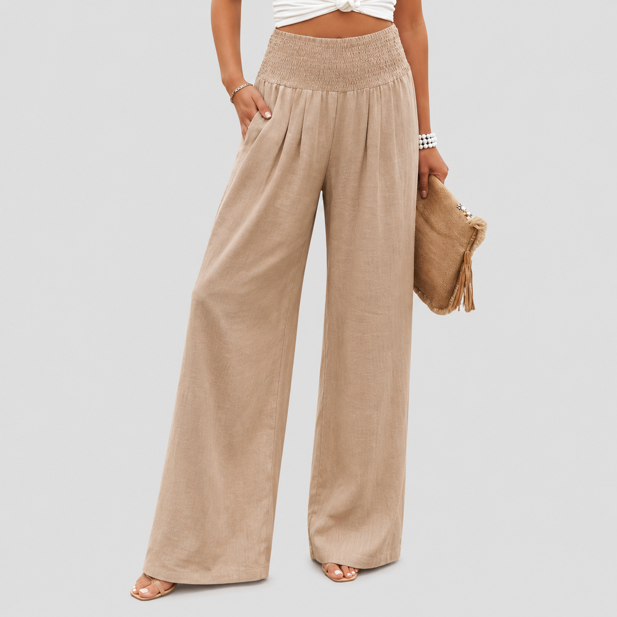 Pantalones anchos para playa Aileen de Warszawska Elegancja, en color claro, con cinturilla y tela ligera para verano.