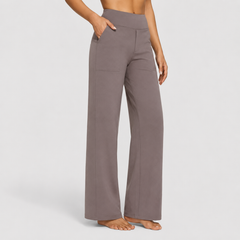 Pantalones elegantes Ame de Warszawska Elegancja, estilo sofisticado y corte ajustado en color neutro.