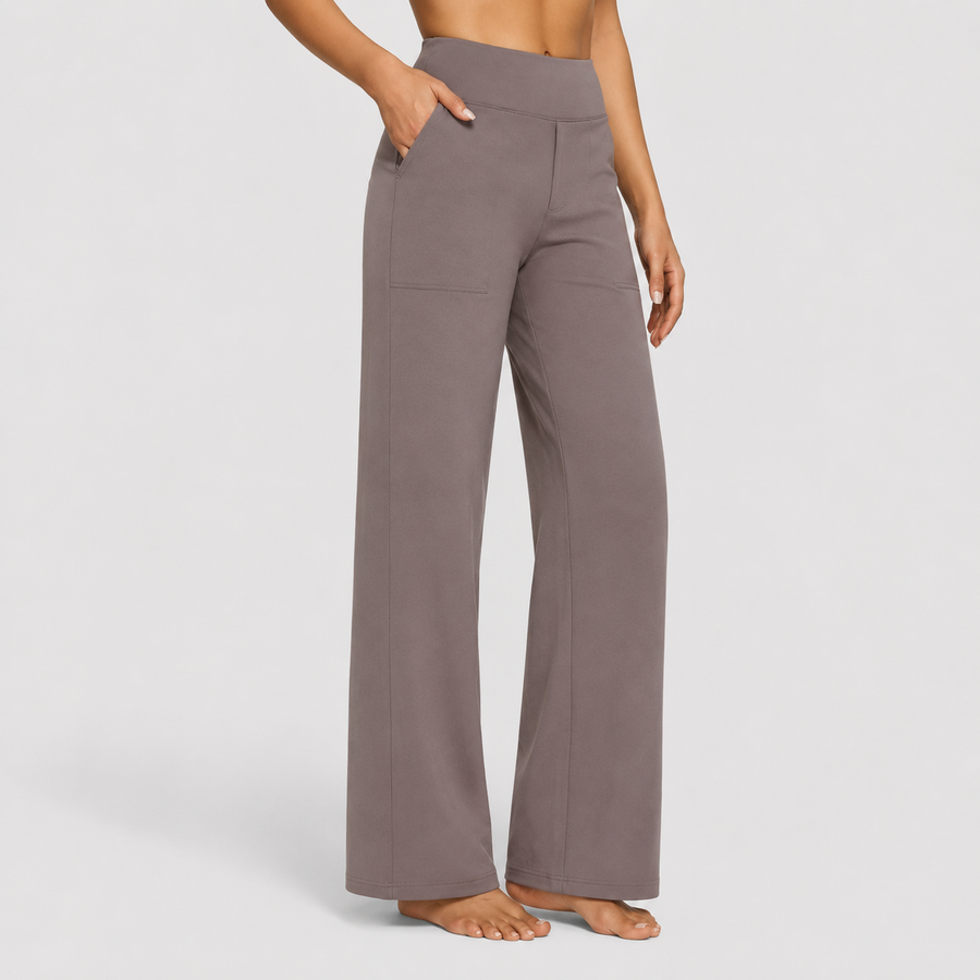 Pantalones elegantes Ame de Warszawska Elegancja, estilo sofisticado y corte ajustado en color neutro.