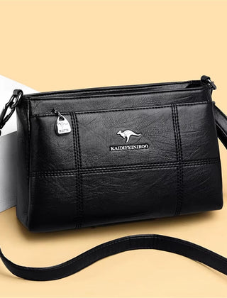 Bolso bandolera Joanna de Warszawska Elegancja con compartimentos y diseño elegante en cuero negro.