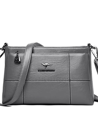 Bolso bandolera Joanna de Warszawska Elegancja, con compartimentos, en cuero negro y diseño elegante.