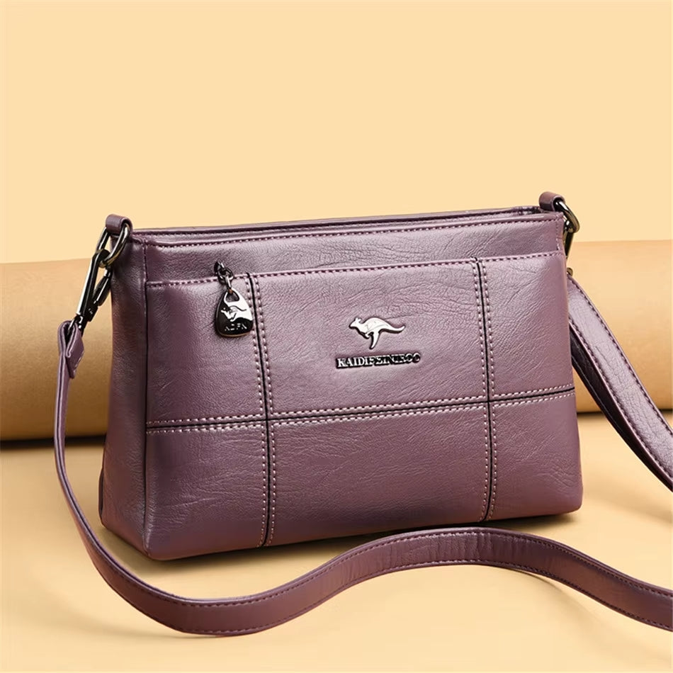 Bolso bandolera Joanna de Warszawska Elegancja con compartimentos y diseño elegante, visible en la imagen.