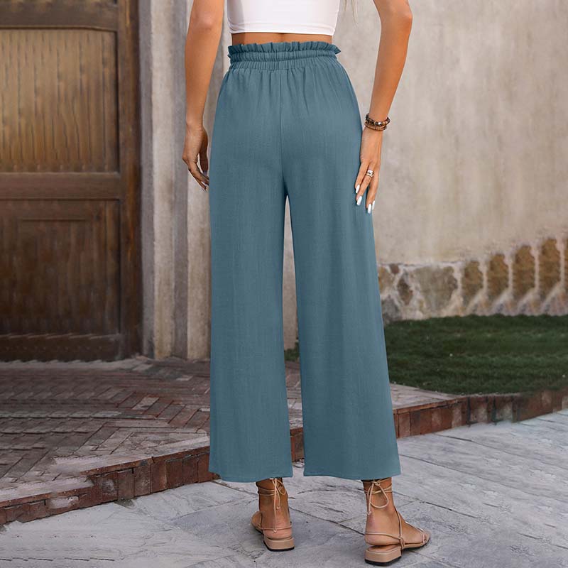 Pantalones lounge Eluna de Warszawska Elegancja en color gris, estilo cómodo y moderno para relajarse.
