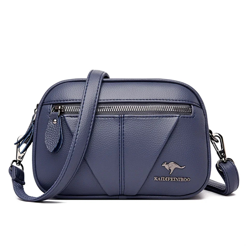 Bolso compacto de piel Kamila de Warszawska Elegancja, elegante y resistente, en color negro con detalles sofisticados.