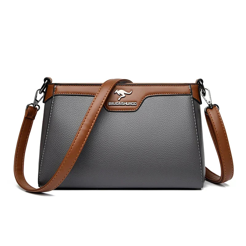 Bolso bandolera Olga de Warszawska Elegancja, cruzada, en cuero con detalles elegantes y asa ajustable.