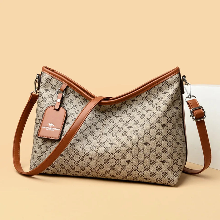 Bolsa floral Patrycja de Warszawska Elegancja con diseño elegante y detalles florales, vista frontal de la cartera de mano.