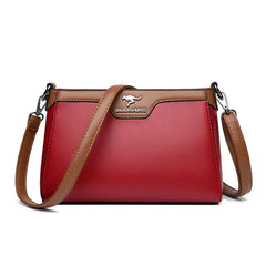 Bolsa cruzada Olga de Warszawska Elegancja, diseñada en cuero con compartimentos y correa ajustable, en color neutro.