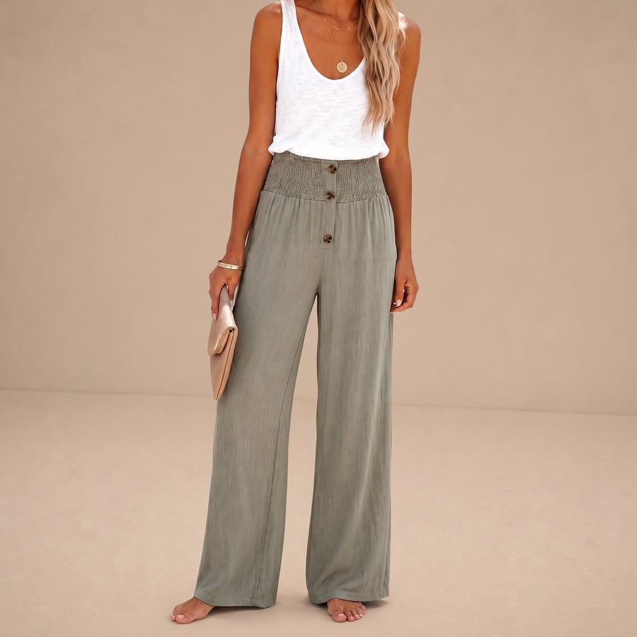 Pantalones relax de cintura alta Riana de Warszawska Elegancja, pantalones cómodos y elegantes para mujer, en color gris claro.