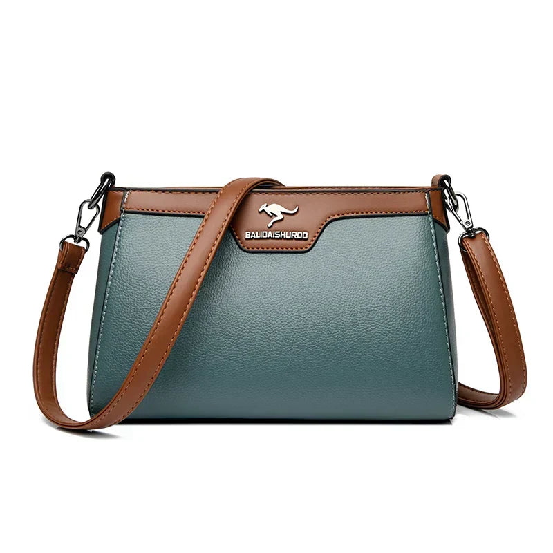Bolso cruzado Olga de Warszawska Elegancja, elegante y compacto, con diseño de un solo lado en color neutro.
