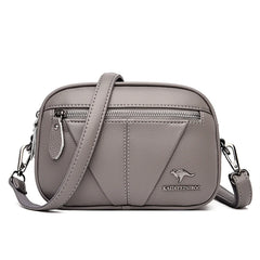Bolsa compacta de cuero Kamila de Warszawska Elegancja, vista frontal con detalles en cuero y herrajes dorados.