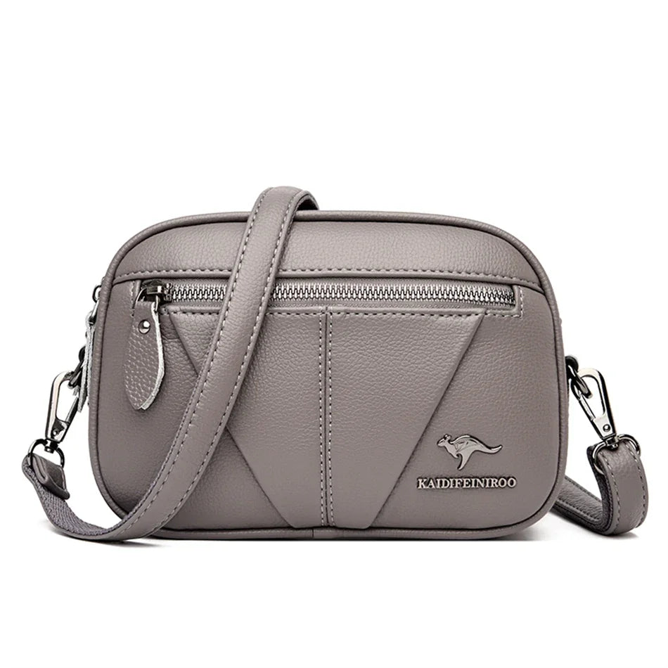 Bolsa compacta de cuero Kamila de Warszawska Elegancja, vista frontal con detalles en cuero y herrajes dorados.