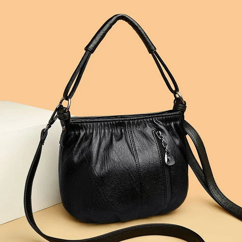 Bolso multicapas Katarzyna de Warszawska Elegancja, diseño contemporáneo y elegante, con múltiples compartimentos y detalles modernos.