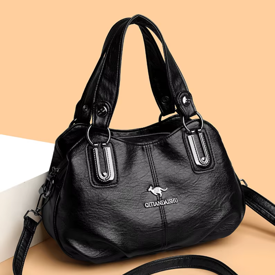Bolsa grande de diseño Lidia de Warszawska Elegancja, en color negro, con detalles elegantes y espacio amplio para uso diario.