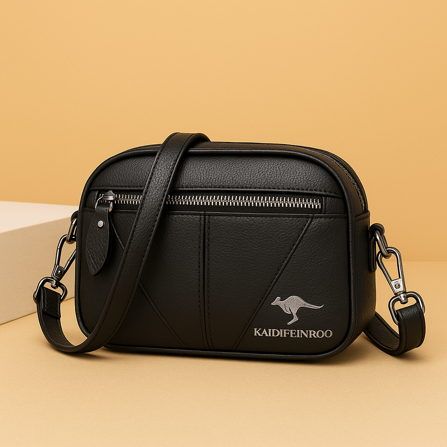 Bolsa de piel compacta Kamila de Warszawska Elegancja, con diseño elegante y detalles en cuero, vista frontal en color negro