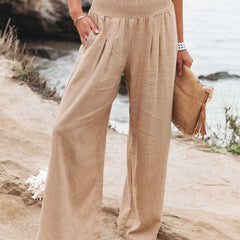 Pantalones anchos beige Aileen de Warszawska Elegancja, ideales para la playa, con estilo cómodo y moderno.