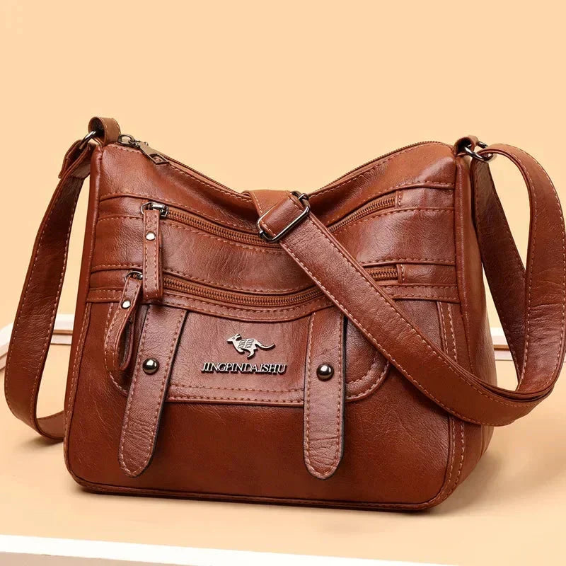 Bolso de mujer de cuero Alicja de Warszawska Elegancja, bolso elegante y azul con asa y detalles en chocolate.