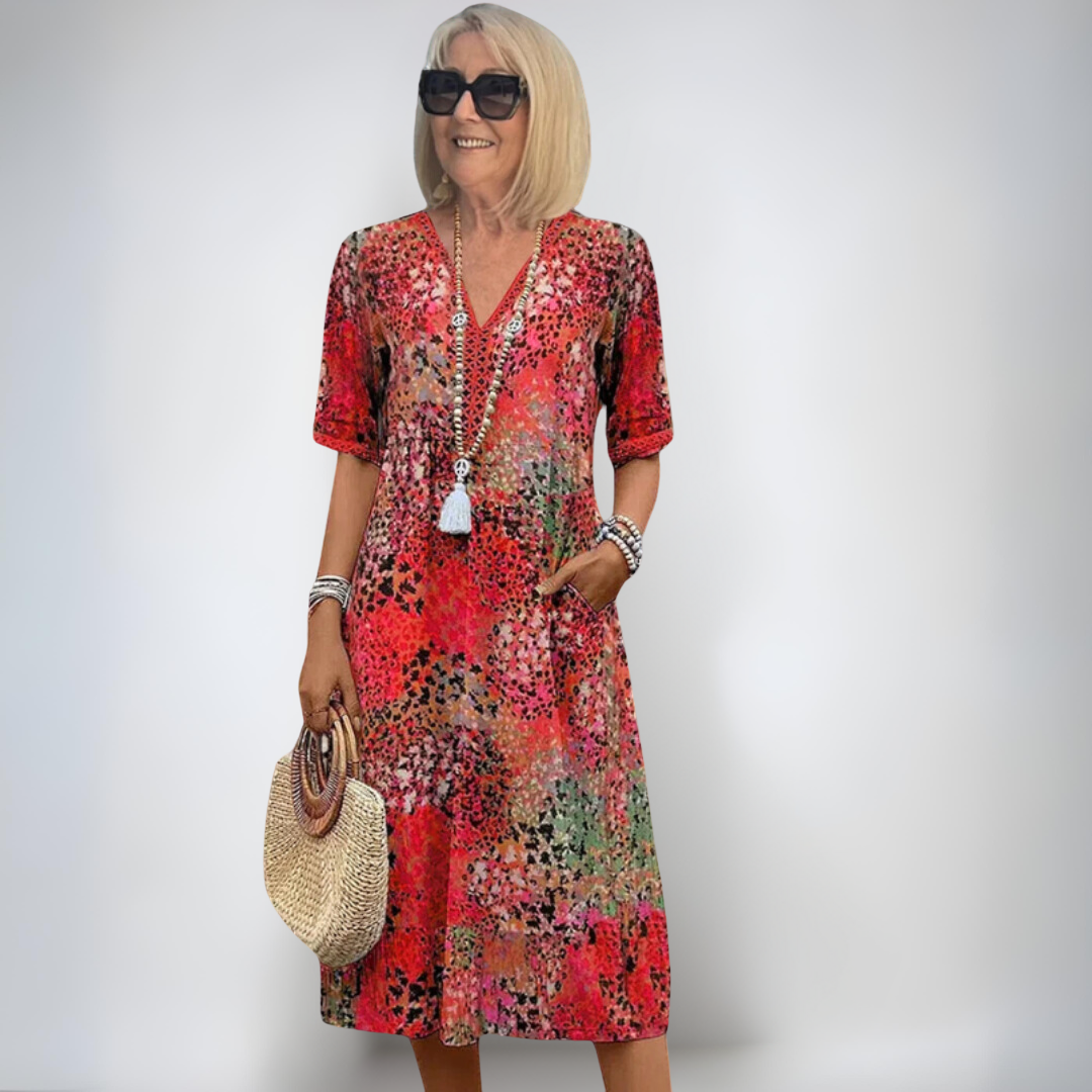 Vestido de primavera Karolína de longitud media de la marca Warszawska Elegancja, con diseño elegante y detalles en la imagen.