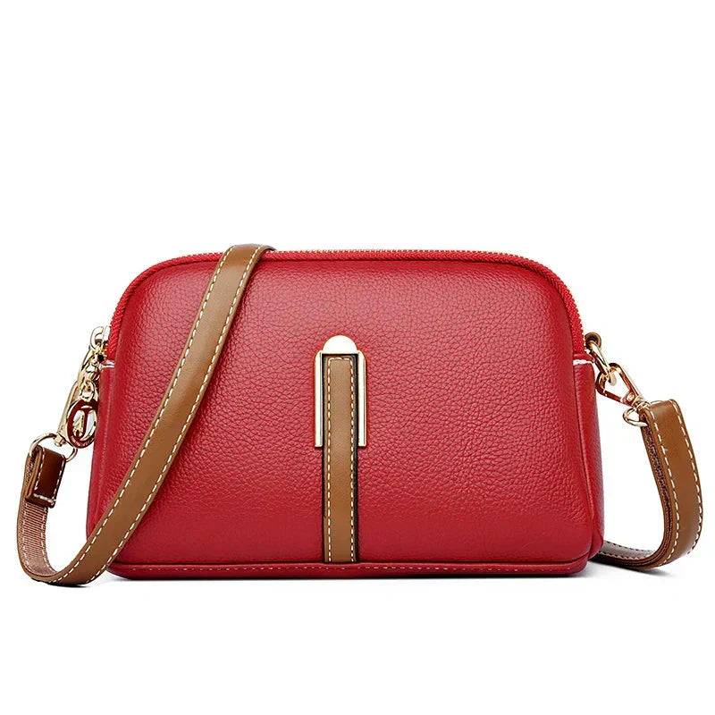 Bolso de mujer Nina de piel azul, diseñado por Warszawska Elegancja, con estilo elegante y detalles sofisticados.