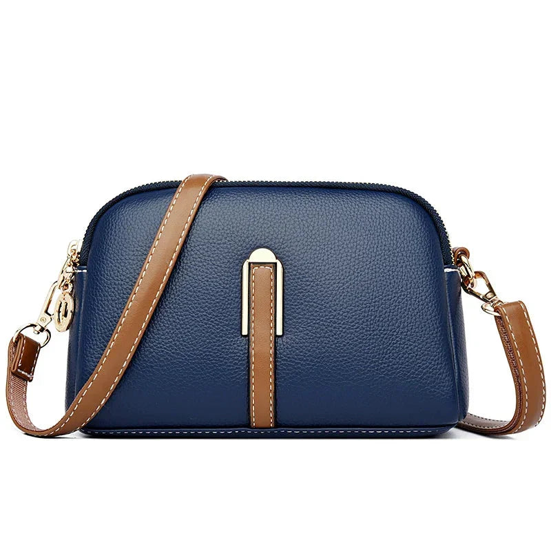 Bolso de mujer Nina de piel azul de Warszawska Elegancja, con diseño elegante y detalles en cuero.