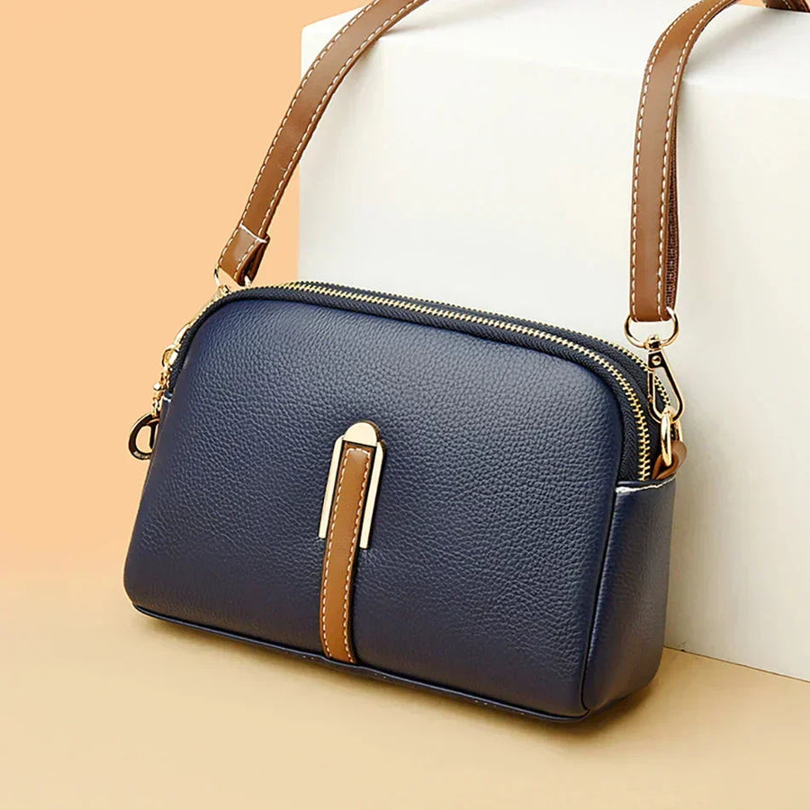 Bolso de mujer Nina de cuero en color azul de la marca Warszawska Elegancja, con diseño elegante y detalles en cuero.