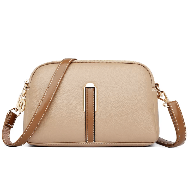 Bolsa de cuero Nina de Warszawska Elegancja en color azul, con diseño elegante y asa para mujer.