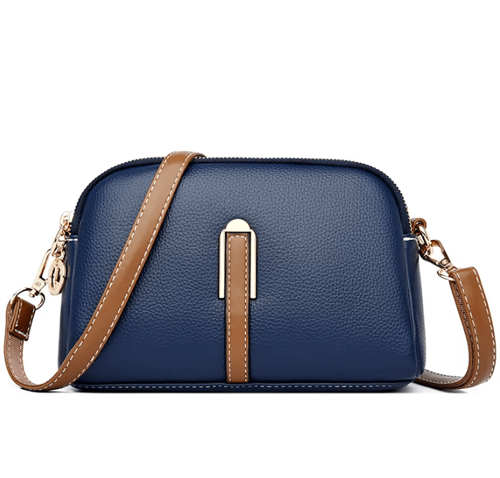 Bolso de mujer Nina de piel de la marca Warszawska Elegancja en color azul con detalles elegantes y asa robusta.