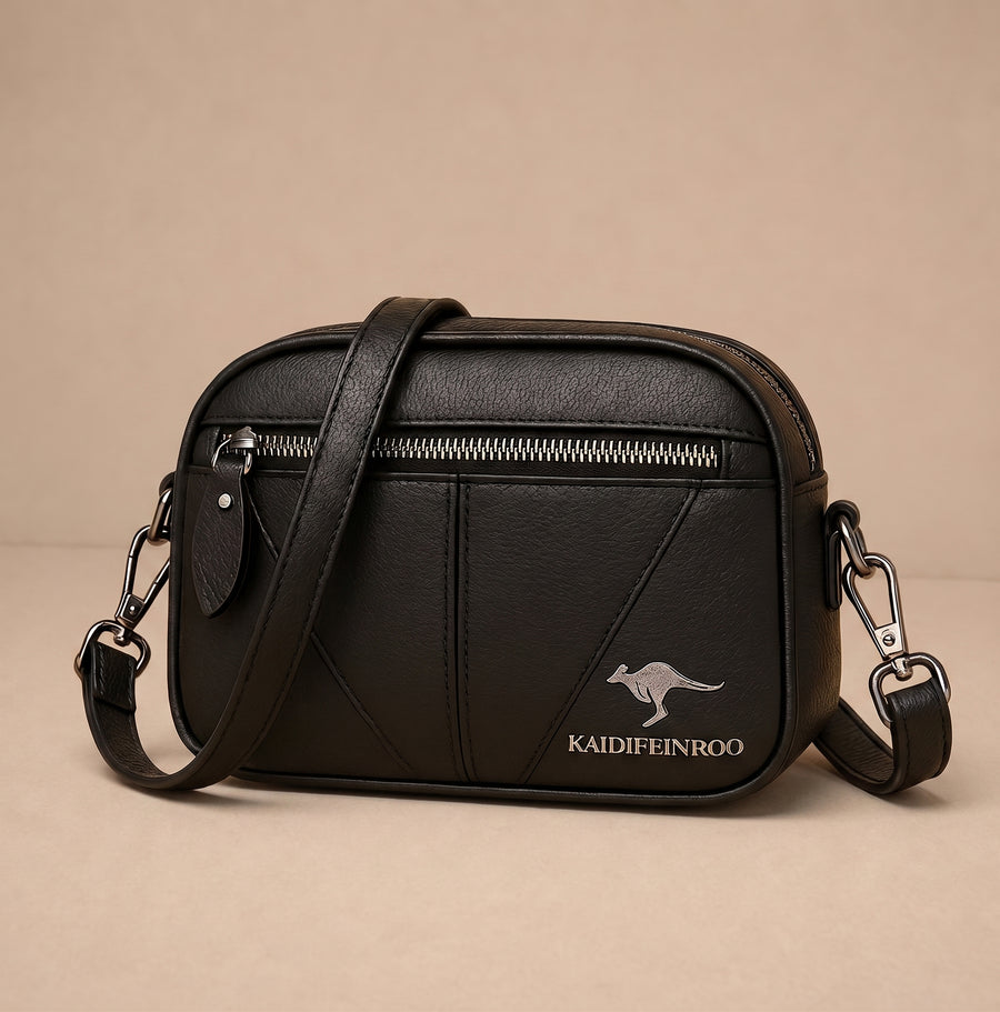 Bolsa compacta de cuero Kamila de Warszawska Elegancja, vista lateral con cierre y asa ajustable.