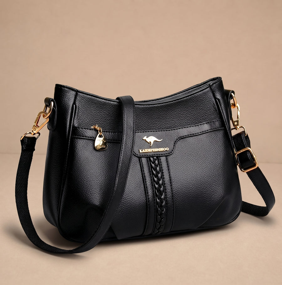 Bolso bandolera Anna de Warszawska Elegancja, elegante y compacto, en color neutro, con correa ajustable y detalles de calidad.