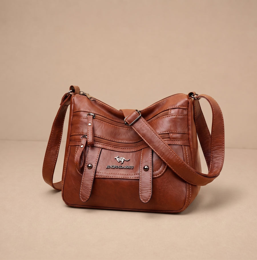 Alicja, bolso de mujer de cuero de Warszawska Elegancja, con diseño elegante y detalles en cuero en color neutro.