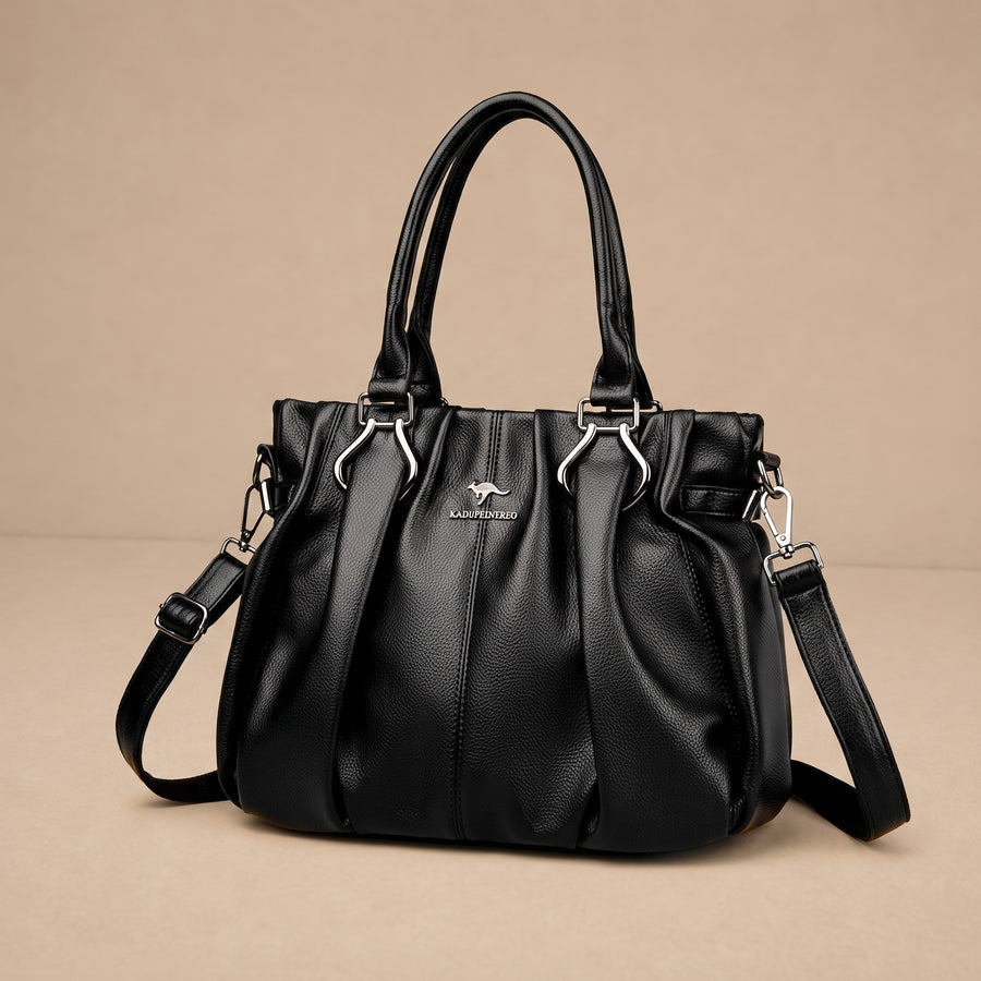 Bolso cruzado Lucyna de Warszawska Elegancja, diseño diario, en color negro, con correa ajustable y compartimentos prácticos.