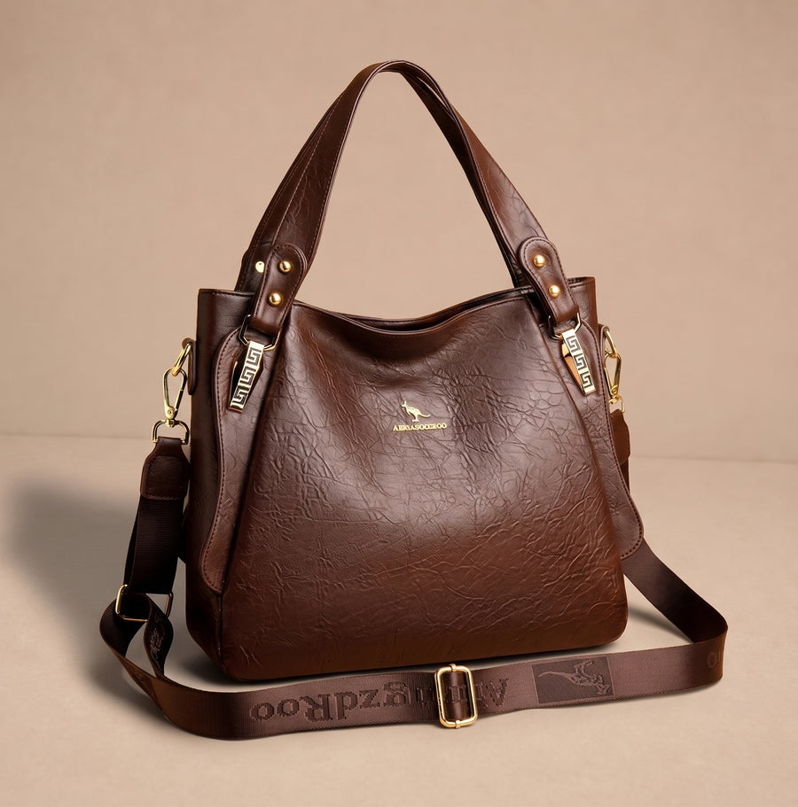 Bolso retro Roksana de Warszawska Elegancja con diseño vintage y detalles elegantes, hecho de cuero en color neutro.