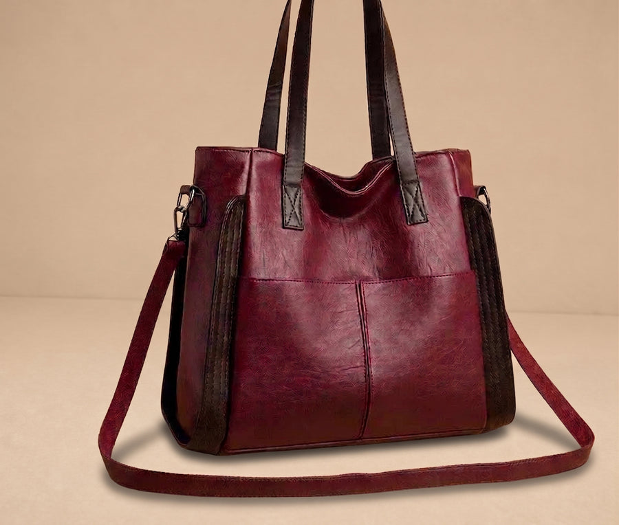 Bolsa de cuero Weronika Indigo Classic de Warszawska Elegancja, con asa y diseño elegante en color azul.