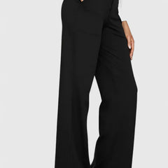 Pantalones elegantes Ame de Warszawska Elegancja, estilo oficina con tacones y corte recto en color neutro.