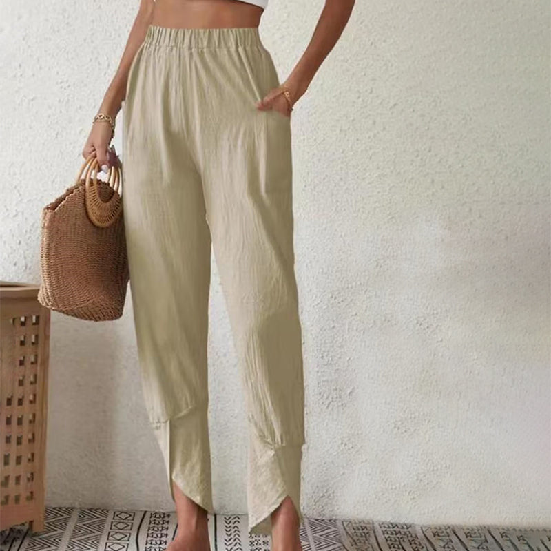 Pantalones de mujer Essari de Warszawska Elegancja con dobladillo crudo y diseño moderno en color neutro.